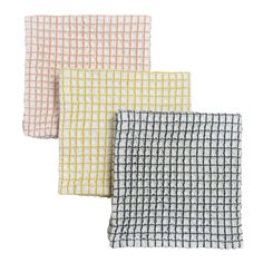 three different colored towels are shown in four different colors and patterns, each with a checkered pattern on the front