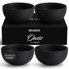 three black bowls sitting on top of each other in front of a box with the packaging