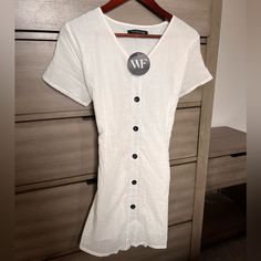 A Dress That’s Perfect For Summer :) Super Lightweight And Flowy With A Tie Back! Brand New! White Mini Dress With Button Closure And Short Sleeves, White V-neck Shirt Dress With Buttons, White V-neck Mini Dress With Buttons, White V-neck Shirt Dress With Button Closure, White V-neck Mini Dress With Button Closure, White Fox, Tie Backs, Boutique Dresses, Linen Dress