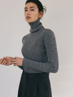 Editor's Notes This is a basic slim turtleneckwith good warmth. It is durable and elastic, so it does not wrinkle easily anddoes not twist shape. It's a product that's easy to wear layered with variousproducts. - Moderate thickness and length- Slim silhouette that fits perfectly- Luxurious mood with solid lip texture- Good for layering with other outerwear Measurements(in.)Size: One Size (XS-M)- Shoulder: 16.54 in.- Chest: 17.32 in.- Sleeve Length: 23.62 in.- Total Length: 24.02 in. * Sizing inconsistency may occur within 0.4inches to 1.18 inches.* Model info: Height 5' 6 / 112lb /Wearing: One Size Composition & Care- 60% Polyester, 40% Nylon- Dry Clean Designer- by YAN13 High Stretch Solid Color Turtleneck For Winter, Gray Fitted Turtleneck For Fall, Fitted Gray Turtleneck For Fall, Fitted Gray Turtleneck For Winter, Fitted Gray Turtleneck Sweater, Grey Turtleneck, Ribbed Turtleneck, Capsule Wardrobe, Layering