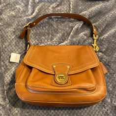 New Tan Coach Handbag Closet Staple Classic. This Is In Perfect Condition And Is Made Of Super Soft Leather With Brass Accents Like The Front Clasp. Was A Present But Not A Brown Wearing Person So Didn’t Ever Use It. Smoke Free Home. Like It? Make An Offer Or Ask Any Questions. Thank Daily Satchel Saddle Bag With Branded Hardware, Daily Use Satchel Saddle Bag With Branded Hardware, Daily Use Saddle Satchel Bag With Branded Hardware, Everyday Top Handle Saddle Bag With Branded Hardware, Daily Use Saddle Bag With Branded Hardware, Top Handle Saddle Bag With Branded Hardware For Travel, Classic Saddle Bag With Branded Hardware For Daily Use, Classic Saddle Bag For Daily Use With Branded Hardware, Designer Saddle Bag For Shopping