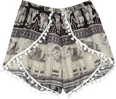 Black and white bohemian elephant print shorts with pom poms in a cross cut with elastic waist. This stylish pair of shorts is perfect for everything from longing, beach, exercise, yoga and meditation to running errands around town and is awesome for holiday relaxation, yoga exercise, nightwear or ordinary day. White Bohemian Shorts With Elastic Waistband, Bohemian Black Shorts For Vacation, Black Bohemian Shorts For Vacation, White Bohemian Shorts For Festival, Bohemian Black Festival Shorts, Bohemian Black Shorts For Festival, Earth Tone Fashion, Beach Exercise, Black And White Bohemian