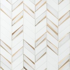 white and gold herringbone tile pattern