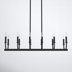 a black chandelier with five candles hanging from it's sides and four lights on each side