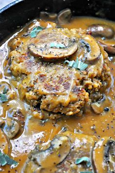 some food is cooking in a pan on the stove top and ready to be eaten