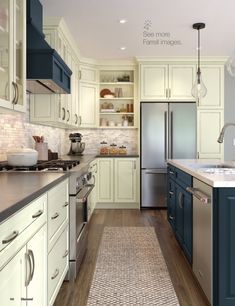 a kitchen with blue and white cabinets, stainless steel appliances and wood flooring is shown