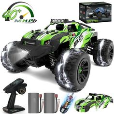 the remote controlled monster truck is green and has lights on it's front wheels