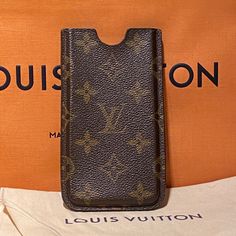 Authentic Louis Vuitton Hard Apple Iphone Sleeve / Case. Excellent Condition. Comes With Louis Vuitton Bag And Dust Cover. Luxury Brown Phone Accessories For Everyday Use, Luxury Rectangular Mobile Phone Bag, Luxury Rectangular Phone Accessories For Travel, Iphone Sleeve, Iphone Hard Case, Louis Vuitton Brown, Vuitton Bag, Dust Cover, Hard Case