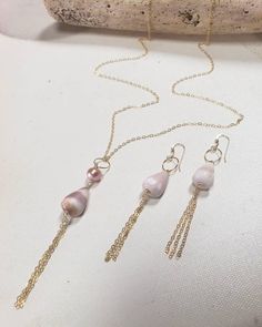 Hand collected pink Maui coneshell and 8mm pink Edison pearl necklace and earring set on 14 karat gold fill. Necklace 22" chain Earrings approx. 2.5" Non tarnish Hypoallergenic Pink Beaded Shell Jewelry, Pearl Drop Dangle Shell, Pink Shell Strand Jewelry, Gold Shell-shaped Beaded Necklace For Gift, Pink Shell Necklace, Pearl Necklace And Earring Set, Edison Pearls, Necklace And Earring Set, Pearl Set