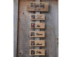 a wooden sign that says the oregon family and has pictures on it, hanging on a wall