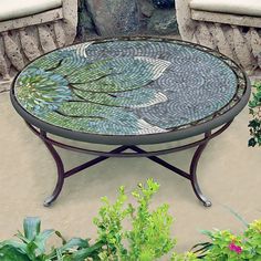 a glass table sitting on top of a patio