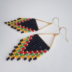 Triangle Beaded Boho Fringe Earrings, Unique Handmade Native American Earrings, a surprisingly light-weight elegant pair that brings a statement finish to any look! ⚜️ Сompletely handmade! ⚜️ Combination of 5 colors - black, gold, red, green, yellow ⚜️ Material - Czech Beads ⚜️ Style - Pierced ⚜️  Length -7,5 cm/2,95 inch ⚜️ Weight for both - 5 g French-style ear wires are silver filled. They come with a pair of rubber ear nuts to prevent loss. To browse more Seed bead fringe earrings please fol Yellow Beaded Earrings, Earring Inspired, Beadwork Earrings, Native American Earrings, Earrings Chandelier, Native American Beaded Earrings, Style Français, Native American Beading