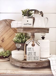 coffee mugs are stacked on top of each other in this rustic styled display with the words coffee and jesus above them