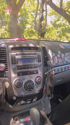 the interior of a car with stickers all over it's dash board and dashboard