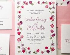 wedding stationery with pink and purple flowers