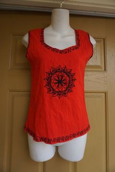 Red with black embroidery sleeveless shirt. No tags -estimated size Small- please see measurements. In good vintage condition!Measurements taken across front lying flatBust-16 inches across front armpit to armpitWaist-15 inches flat across frontLength-22 inches Batik Scarf, Embroidered Tank Top, Embroidered Tank, Half Shirts, Black Embroidery, Scarf Dress, Career Wear, Shirt Fits, Top Sleeveless