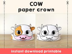 two paper crowns with cows on them, one is brown and the other is white