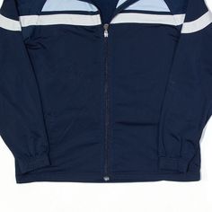 Item is in good used condition. Label says age 13-15. >Size: XL >Armpit To Armpit: 20" >Armpit To Cuff: 19" >Collar To Hem: 26" Outdoor Blue Track Jacket With Ribbed Cuffs, Blue Varsity Track Jacket For Sports, Blue Varsity Hooded Track Jacket, Navy Sportswear Track Jacket For Streetwear, Blue Track Jacket With Ribbed Cuffs For Streetwear, Blue Sporty Track Jacket With Ribbed Cuffs, Navy Cotton Track Jacket For Sports, Sporty Blue Track Jacket For Jogging, Casual Navy Track Jacket For Sports Events