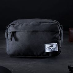 * Spacious interior
 * Secure side pockets
 * Black faux-leather zip toggles
 * Strong, durable construction Lewis Black, Lazy Bear, Leather Toiletry Bag, Wash Bag, Nixon, Herschel, Soft Black, Wash Bags, Black Faux Leather