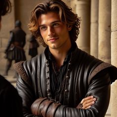 a man in leather jacket standing next to columns