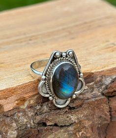 Unveil the mystical allure of our handcrafted Labradorite Ring, a beauty showcasing the iridescent magic of labradorite. Set in sterling silver, each natural labradorite stone is chosen for its unique hues. Known as black moonstone the healing gemstone makes every ring a one-of-a-kind treasure. Perfect for those who adore bohemian elegance or seek the meaningful, mystical charm of handmade jewellery. ➵ Metal: Solid 925 Sterling Silver ➵ US Ring Size: Choose Size ➵ Gemstone: Labradorite (Black Moonstone) ➵ Style: Vintage, Bohemian, Cabochon ➵ Packaging: Sustainable Box (Letterbox) To all the wonderful humans that support my small business... THANK YOU ❤️    **         DELIVERY         ** UK  ➵ 1st Class Signed For - £3.45 (1-2 business days) EU ➵ International Tracked and Signed  - £8.65 (1 Mystical Cabochon Rings As A Gift, Spiritual Cabochon Moonstone Ring, Handmade Mystical Iridescent Ring, Mystical Handmade Iridescent Ring, Handmade Iridescent Mystical Ring, Bohemian Oval Labradorite Jewelry, Handmade Mystical Opal Ring For Gift, Handmade Bohemian Moonstone Crystal Ring, Handmade Adjustable Spiritual Moonstone Ring