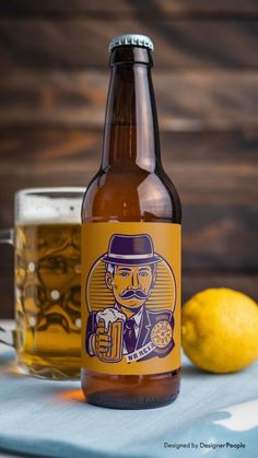 a bottle of beer sitting on top of a table next to a lemon