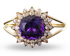 Weighing approximately 50 carats, the cushion-cut amethyst at the center of this bangle bracelet exhibits the deep, evenly distributed purple color found in only the finest examples. Creating a starburst motif around the amethyst are approximately 5 carats of diamonds. 18K yellow gold. Golconda Diamond, Statement Bracelets, Diamond Bangle Bracelet, Amethyst And Diamond Ring, Amethyst Healing, Jewelry For Sale, Brace Yourself, Diamond Bangles Bracelet, Amethyst Jewelry