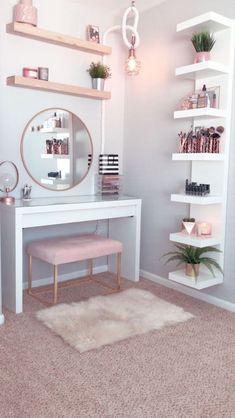 a white desk with a mirror and shelves on it in front of a pink rug