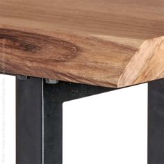 a close up of a wooden table with metal legs and a wood slab on top