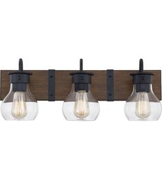 three light bathroom fixture with clear glass globes and black metal fittings on the wall