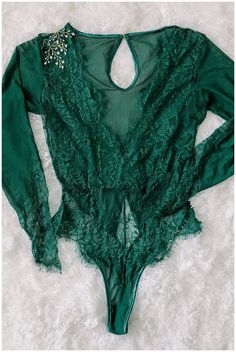 Elena Bodysuit- Emerald (This beautiful bodysuit is final sale due to price, unless product is damaged or you need an exchange for a different size.)  Size Chart:  XS: 30-32 bust, 21.5-32.5 waist, 32-34 hip.  Small: 32-34 bust, 23.5-25.5 waist, 34-36 hip Medium: 34-36 bust, 25.5-27.5 wasit, 36-38 hip Large: 36-38 bust, Green Fitted One-piece Bodysuit, Fitted Green One-piece Bodysuit, Elegant Long Sleeve Green Bodysuit, Elegant Green Long Sleeve Bodysuit, Green Stretch Bodysuit For Party, Green Fitted Bodysuit For Party, Green Fitted Backless Bodysuit, Green One-piece Bodysuit With Lined Body, Green One-piece Bodysuit For Party