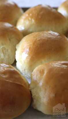 closeup of freshly baked bread rolls on a baking sheet, ready to be eaten