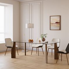 a glass table with chairs around it in a room