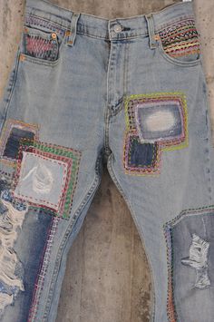 "Ready to send : Size 34 ,33,32,31 Unique vintage jeans with apcycled patches. One of a kind.. Hand made embroidery and unique painting .... ---Or---- Made to order, in any size, within 7 working days . If you need different size, please send me a message and I will make you a special and unique design within 2 working days. They are all different! No one will have the same one as you have! Hand painted, one of kind jeans. You pick your size, model (slime- boyfriend- high waist- low waist) and p Multicolor Patchwork Denim Jeans, Trendy Distressed Multicolor Jeans, Blue Distressed Bohemian Jeans, Bohemian Distressed Blue Jeans, Bohemian Blue Distressed Jeans, Festival Patchwork Denim Jeans, Festival Denim Jeans With Patches, Multicolor Patchwork Jeans For Festival, Multicolor Distressed Denim Jeans