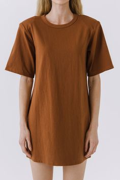 This Shoulder Pad T-Shirt Dress is a wardrobe must-have! Featuring a stylish round neckline, short sleeves, and a boxy silhouette, it's the perfect addition to any outfit. Our unique shoulder pad insert adds structure and a touch of sass, making this dress a standout. With its comfortable fit and comfortability, you'll look amazing no matter what the occasion. Show off your fashion-forward style with this shoulder-pad t-shirt dress! Shoulder pad inserted Round neckline Short sleeves Boxy silhoue Brown Crew Neck T-shirt For Work, Brown Short Sleeve T-shirt For Work, Relaxed Fit Short Sleeve T-shirt Dress For Fall, Fall Relaxed Fit Short Sleeve T-shirt Dress, Shoulder Pad T Shirt, Brown Oversized Short Sleeve Dress, Oversized Short Sleeve T-shirt Dress, Solid Color Cotton T-shirt Dress With Crew Neck, Casual Black Short Sleeve T-shirt Dress