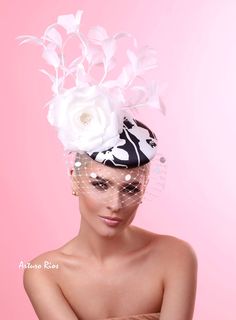 Sophia From my Spring collection here is this gorgeous black and white fascinator, made on a round base covered with a printed silk fabric, embellished with an off-white Silk rose, white goose feathers tree and veil with dots. it includes a black elastic to secure it around your head. All hats are hand made to order, please allow 2 weeks. it might take longer depending on the season. If this is a rush order, please contact me first. All sales are final. feel free to ask any question. Hat Fashion Photography, Butterfly Cards Handmade, Blush Pink Fascinator, Royal Blue Fascinator, White Fascinator, Flapper Headpiece, Printed Silk Fabric, Kentucky Derby Fascinator, Pink Fascinator