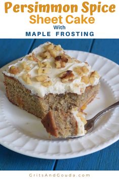 a piece of cake on a white plate with frosting and nuts in the middle