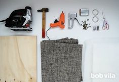 tools and materials laid out on a white surface