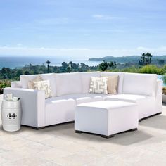 a large white couch sitting on top of a patio