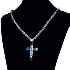 Styling a bright electric blue finish, the silver metallic coat of this cross pendant design is contrasted brilliantly. The entire pendant, originally crafted from 316L stainless steel and sized at 50 mm x 32mm, features a trendy mechanical cross design that is embellished with multi cubic zirconia crystals. The Innovato Design set is made complete by a long silver link chain necklace.  Product Highlights    Two-tone finish for pendant and necklace  Made from durable 316L stainless steel  Link chain necklace included Blue Stainless Steel Chain Jewelry, Blue Pendant Cross Necklace Gift, Blue Crucifix Cross Necklace For A Gift, Blue Cross Necklace For Gift, Cross Pendant Design, Chain Link Necklace Silver, Wood Inlay Rings, Dolphin Bracelet, Byzantine Chain