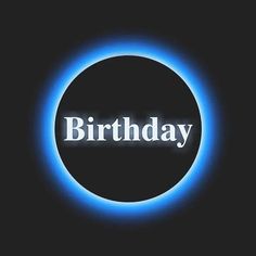 the words birthday are lit up in front of a black background with a blue circle