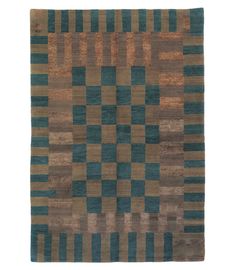 a brown and blue rug with squares on the bottom, in different shades of green