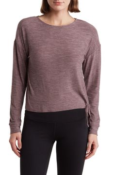 Head to the gym or studio in this slouchy long-sleeve top constructed from soft jersey with a side tie for trendy style. Crewneck Long sleeves Moisture-wicking fabric engineered for dryness and comfort 94% polyester, 6% spandex Hand wash, line dry Imported Model stats: 5'10" height, 32" bust, 25" waist, 36" hip. Model is wearing size Small. Jersey Top, Moisture Wicking Fabric, Trendy Fashion, Long Sleeve Tops, Nordstrom, Tops & Tees, Top Outfits, Long Sleeve, Clothes For Women