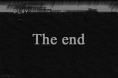 the word the end written in white on a black and white background with vertical stripes