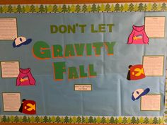 a bulletin board that says, don't let gravity fall with pictures of clothing on it