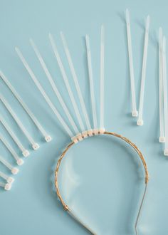 a bunch of white toothbrushes on a blue surface