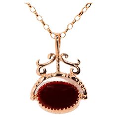 The Callie Pendant & Chain is a gorgeous vintage adornment that ribbons and scrolls its way to a spinner of crimson carnelian and onyx. Her precious gems are embraced by beautiful garlands of flowers carved into 9 carat rose gold. The Callie Pendant Gem Details The carnelian cabochon is an orange red colour and measures 17.4x12.4 millimetres.The black onyx cabochon measures 17.4x12.4 millimetres. Size The pendant measures approximately 23.9x13.9 millimetres, and the length of the chain is approximately 50 centimetres. Condition Vintage. Circa 1980s. Great to know The Callie Pendant & Chain belongs to our treasure trove of strongly sustainable, ethical, environmentally friendly, and conflict-free jewellery. She lives in our carefully curated collection of one of a kind vintage jewellery pie Blink Blink, Red Colour, Flower Garlands, Precious Gems, Vintage Jewellery, Free Jewelry, Orange Red, Black Onyx, Or Rose