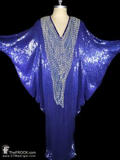 "BIG NEWS After 22 years, our website, TheFROCK.com, has had a makeover. Check out the new site, we're having our EASTER SALE there, and here in our Etsy shop too. (Sale prices are also good for new layaways.)  Vintage Halston (mainline) blue sequined, floor length, dolman sleeved caftan maxi dress with extravagant pearl beadwork. Rear zip. Because of the batwing dolman sleeves, this will fit most sizes. It measures 40\" wide at its narrowest (around the knees, it's much wider above that), lengt Fitted Sequin Kaftan For Parties, Embellished Blue Kaftan For Party, Blue Embellished Kaftan For Party, Blue Sequined Party Kaftan, Evening Maxi Dress With Batwing Sleeves, Blue Sequined Kaftan For Party, Vintage Halston, Sequined Gown, Vintage Couture