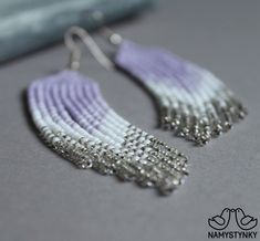 These light purple beaded earrings are made of high-quality Czech beads and strong synthetic thread. They are elegant, fashionable, and highly versatile, suitable for everyday wear. Features: Sterling silver components Color: purple, white, silver. This item is currently in stock. You must be completely satisfied. If you find merchandise unsatisfactory for any reason, return it within 10 days and your money will be refunded without questions. More beaded earrings http://etsy.me/2ycItdb Gerdan ne Lavender Beaded Dangle Earrings, Lavender Adjustable Dangle Beaded Earrings, Handmade Adjustable Lavender Beaded Earrings, Bohemian Lavender Earrings With Dangling Beads, Bohemian Lavender Beaded Dangle Earrings, Lavender Beaded Drop Earrings, Lavender Drop Beaded Earrings, Handmade Lavender Beaded Earrings For Gift, Handmade Purple Beaded Drop Earrings