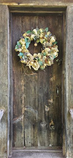 a wooden door with a wreath on it